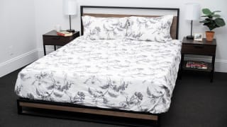 Bed made with floral flannel sheets