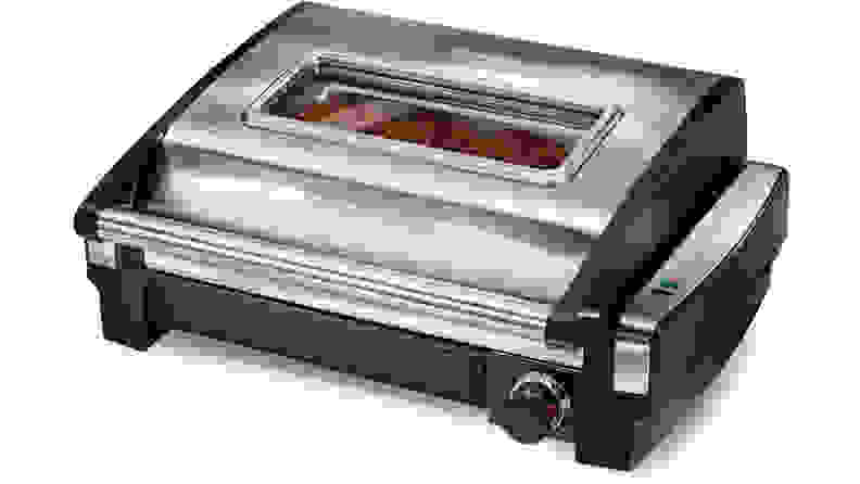 A silver  Hamilton Beach Searing Grill with Window viewed from a front left angle.