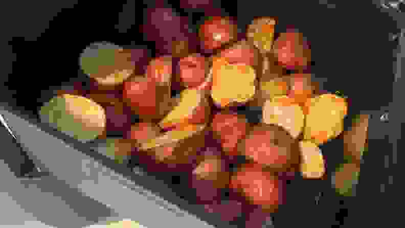 A batch of roasted red potatoes inside the Midea air fryer basket