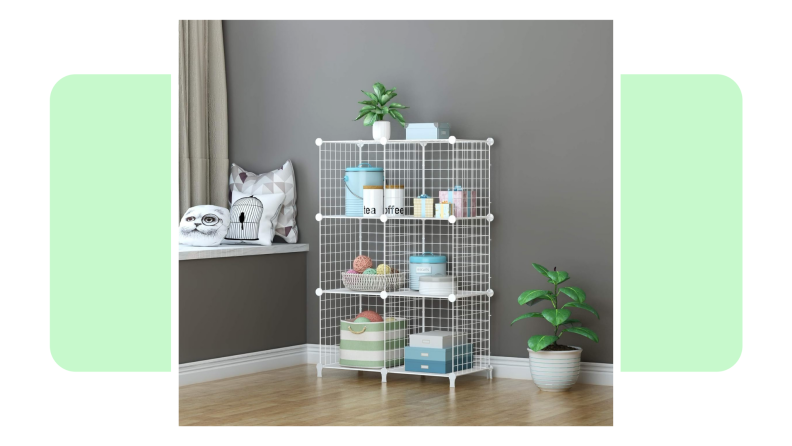 Six wire cubes stacked on top of each other inside of home filled with cloth storage containers and other items.