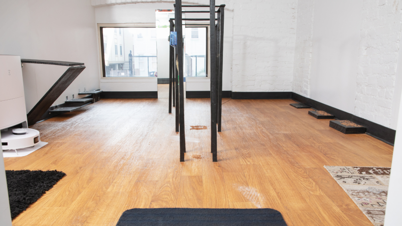 Room with hardwood floors filled with assorted obstacle tasks for robot vacuum to test.