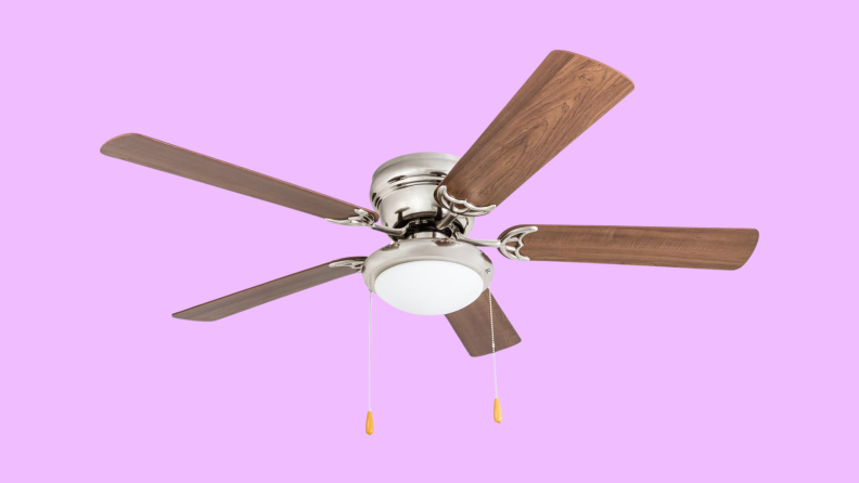 A Portage Bay ceiling fan appears on a purple background.