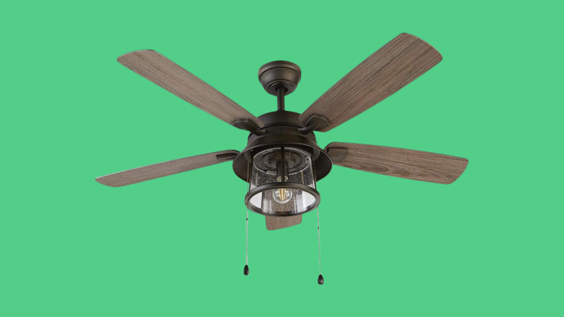 One of the best ceiling fans for outdoor use, the Shanahan is shown on a green background.