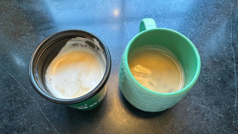 A cappuccino and latte from the Bosch espresso maker on a black surface