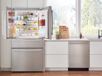 Bosch B36CL80SNS stainless steel fridge open in a kitchen.