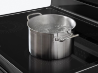 A pot of water boils quickly on a convection range