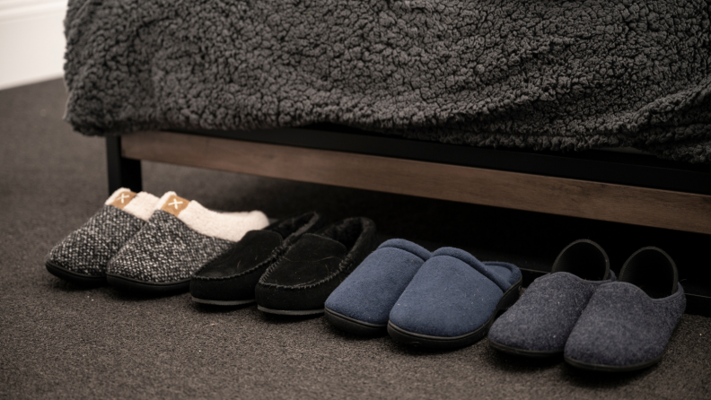 Slippers lined up by a bed.