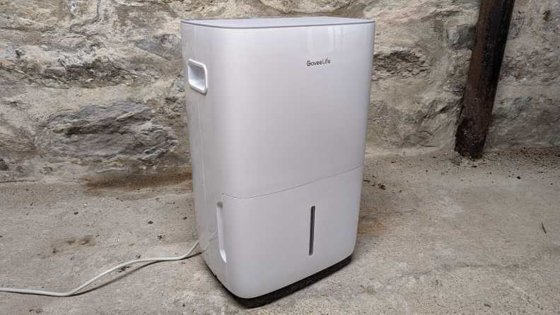 The efficient Energy Star rated GoveeLife H7151 50 pint dehumidifier in a damp basement.