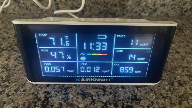 The AirKnight indoor air quality monitor sitting on a countertop.